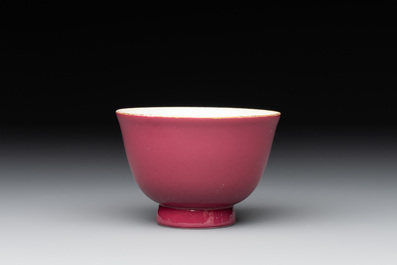 A fine Chinese ruby-ground famille rose 'magnolia' cup, Qianlong mark and of the period