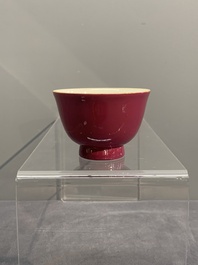 A fine Chinese ruby-ground famille rose 'magnolia' cup, Qianlong mark and of the period