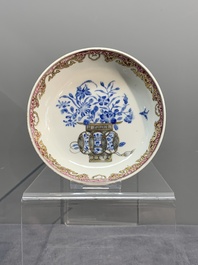 A Chinese gilt-decorated blue- and-puce-enamelled 'flower basket' cup and saucer, Qianlong