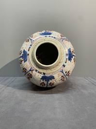 A pair of Chinese Imari-style 'grapevine' jars with wooden covers and stands, Kangxi