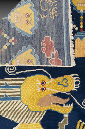 A Chinese inscribed woollen 'dragon' pillar carpet, 19th C.
