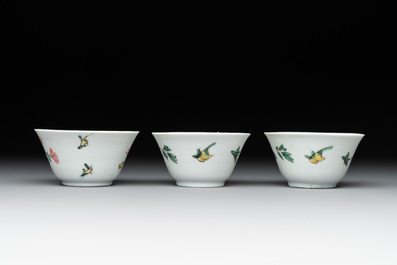Three Chinese famille rose 'birds and flowers' cups and saucers, Yongzheng