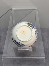 A Chinese gilt-decorated blue- and-puce-enamelled 'flower basket' cup and saucer, Qianlong