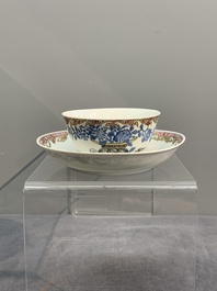 A Chinese gilt-decorated blue- and-puce-enamelled 'flower basket' cup and saucer, Qianlong