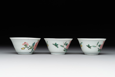 Three Chinese famille rose 'birds and flowers' cups and saucers, Yongzheng