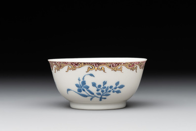 A Chinese gilt-decorated blue- and-puce-enamelled 'flower basket' cup and saucer, Qianlong