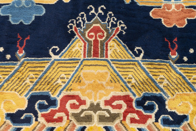 A Chinese inscribed woollen 'dragon' pillar carpet, 19th C.