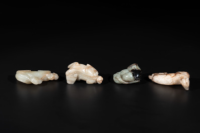 Five Chinese jade carvings with four wooden stands, 19th C.