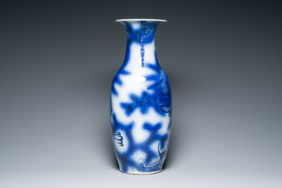 A Chinese blue and white 'dragon and carp' vase, 19th C.