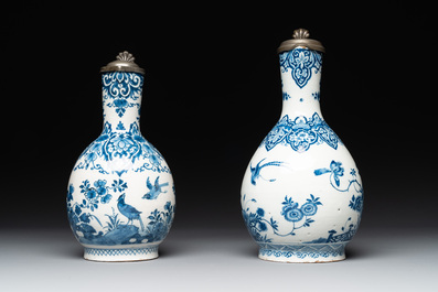 Two blue and white Dutch Delft jugs with pewter mounts, early 18th C.