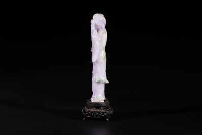 A Chinese lavender- and mint-green-jade figure of a goddess holding a sceptre and fan on wooden stand, 19th C.