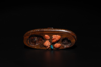 A Chinese pink-orange coral group of a goddess of spring, a wise man and children in a pine tree, 19/20th C.