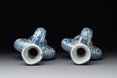 A pair of blue and white Dutch Delft circular jugs, 19th C.