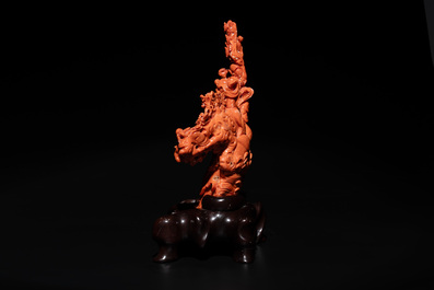 A Chinese red coral group of goddesses on wooden stand, 19/20th C.