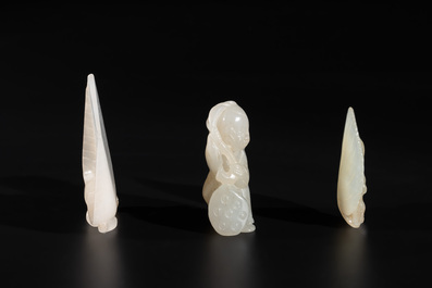 Three Chinese white and celadon jade carvings of a boy and two monkeys, 19th C.