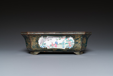 A Chinese Canton enamel gilt-decorated dark-green-ground jardini&egrave;re with four inserted plaques, Qianlong/Jiaqing