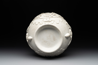 A Chinese white-glazed biscuit 'hu' vase with dragons, Qianlong mark, 19/20th C.