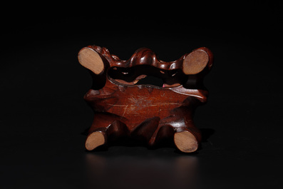 A Chinese red coral group of goddesses on wooden stand, 19/20th C.