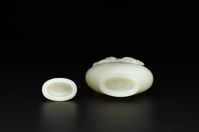 A fine Chinese white jade 'Buddhist lions' vase and cover, Qing