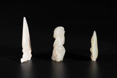 Three Chinese white and celadon jade carvings of a boy and two monkeys, 19th C.