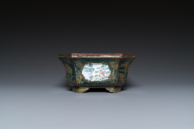 A Chinese Canton enamel gilt-decorated dark-green-ground jardini&egrave;re with four inserted plaques, Qianlong/Jiaqing