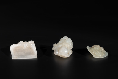 Three Chinese white and celadon jade carvings of a boy and two monkeys, 19th C.
