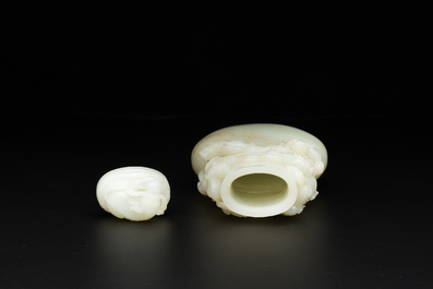 A fine Chinese white jade 'Buddhist lions' vase and cover, Qing