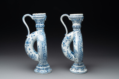 A pair of blue and white Dutch Delft circular jugs, 19th C.