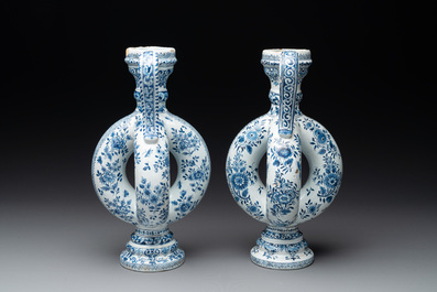 A pair of blue and white Dutch Delft circular jugs, 19th C.