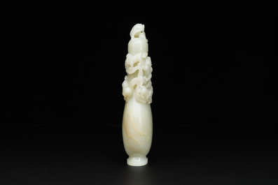 A fine Chinese white jade 'Buddhist lions' vase and cover, Qing