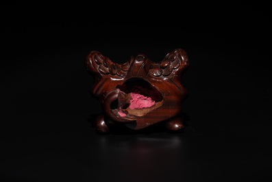 A Chinese red coral group of goddesses on wooden stand, 19/20th C.