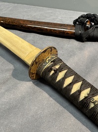 A collection of fine Japanese sword handles, guards, sheaths, a sword and a lacquered stand, Edo, 18/19th C.