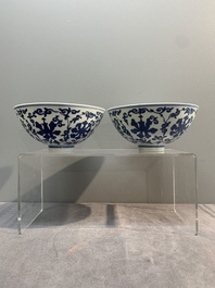 A pair of Chinese blue and white 'lotus scroll' bowls, Yongzheng mark and possibly of the period