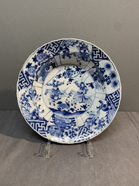A Chinese blue and white 'warriors on horseback' 'klapmuts' bowl, Kangxi mark and of the period