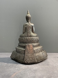 A Cambodian silver repouss&eacute; Buddha with inscription, 19th C.