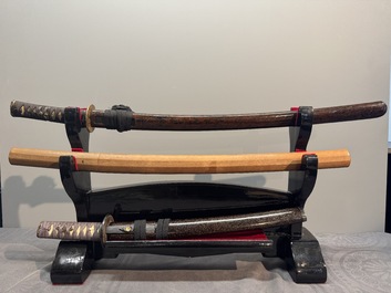 A collection of fine Japanese sword handles, guards, sheaths, a sword and a lacquered stand, Edo, 18/19th C.