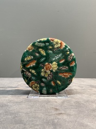 A pair of Chinese famille verte green-ground 'prunus' jars and covers, 19th C.