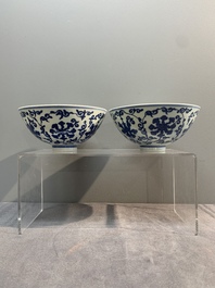 A pair of Chinese blue and white 'lotus scroll' bowls, Yongzheng mark and possibly of the period