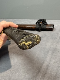 A collection of fine Japanese sword handles, guards, sheaths, a sword and a lacquered stand, Edo, 18/19th C.