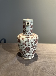 A Chinese copper-red and white 'flower scroll' ewer, Ming or later