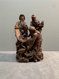 A Chinese carved wooden 'Fu Lu Shou' group, 19/20th C.