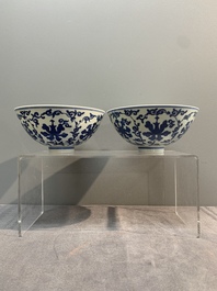 A pair of Chinese blue and white 'lotus scroll' bowls, Yongzheng mark and possibly of the period