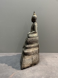 A Cambodian silver repouss&eacute; Buddha with inscription, 19th C.