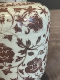 A Chinese copper-red and white 'flower scroll' ewer, Ming or later