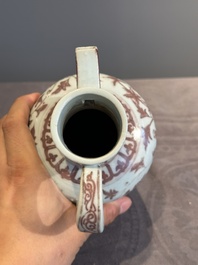 A Chinese copper-red and white 'flower scroll' ewer, Ming or later