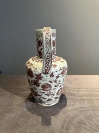 A Chinese copper-red and white 'flower scroll' ewer, Ming or later