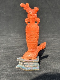 A Chinese carved red coral 'mythical animals' snuff bottle on stand, 19/20th C.