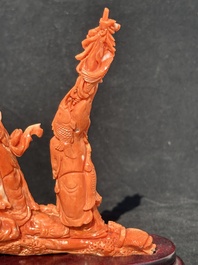 A Chinese red coral 'Sanxing' group on wooden stand, 19/20th C.
