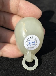 A Chinese white jade cup and two rings, Qing