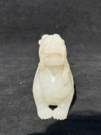 A Chinese white jade carving of a mythic animal, 19/20th C.